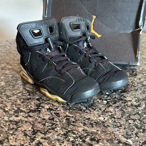 Jordan Black and Gold High-Top Sneakers 7Y